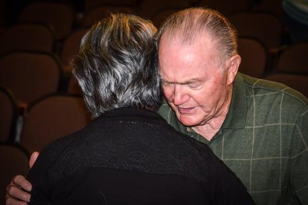 Grandpa Stewart praying for people. What a legacy!