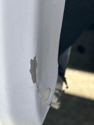 Damaged paint from stress fractures, likely when they pulled off the plastic plug or when they were swinging their hammers