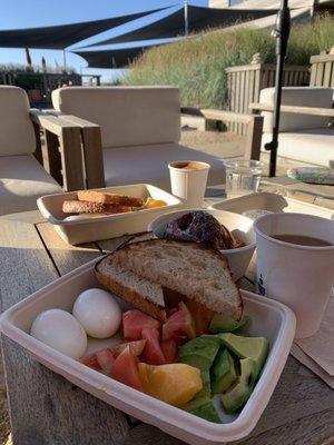 Soft-boiled eggs with heirloom tomatoes, avocado and toast