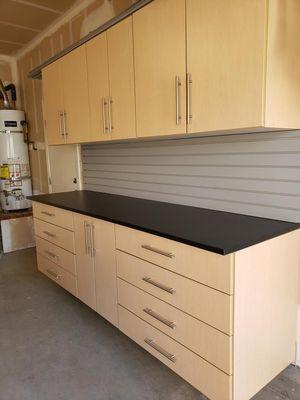 8' work area with 3' Drawer Cabinets with a 2' Cabinet area for storage with matching upper cabinets.