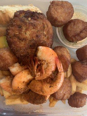 Crab cake, fried sea scallops, steamed shrimp and fries.