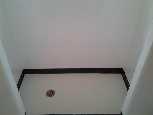 Grout lines are clean and Mold and mildew issues gone, tile repaired. Tile shower looks like new.