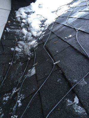 Deice cable on roof shingles to stop ice damning