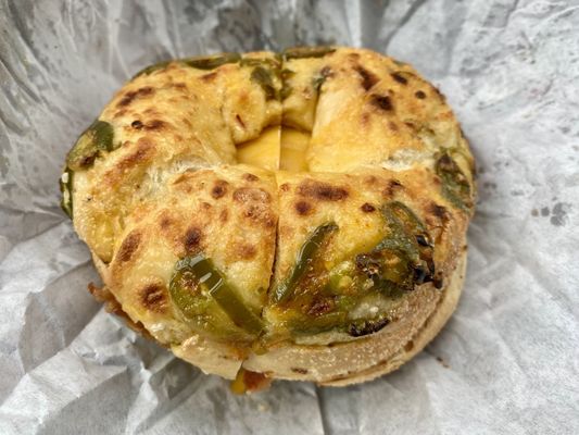 Breakfast sandwich with bacon, egg, and cheese on  a jalapeño cheddar bagel - Delicious!