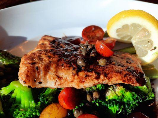 Halibut with capers, heirloom tomatoes, over broccoli and asparagus.