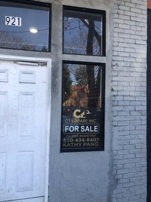 "For sale" sign on window