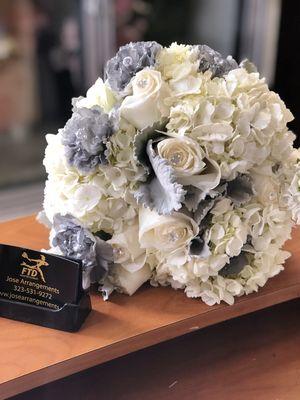 Silver and white wedding bouquet done here at Jose arrangement