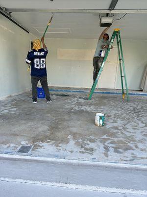 Here we were painting the whole garage in this picture we are doing the ceiling.