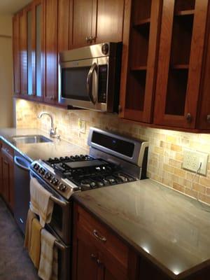 great cooking area with lots of space (installation of art glass on open cabinet doors forthcoming)