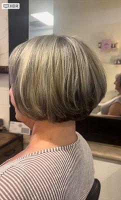 She wants to grow her hair so we lifted the back as her desired style is shorter in the back forward. Hi & lowlights in Ashy tones