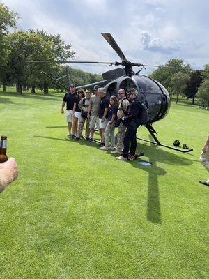 Pre-jump photo with clients, next to the Heli Chicago OH-6A helicopter.