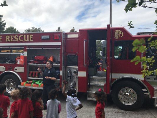 Teaching the kids about the fire trucks