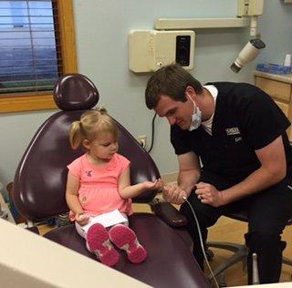 Dr. Smiley with his sweet little patient