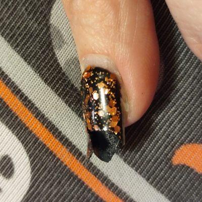 Polish split 2 weeks later. Gooey black underneath. Acrylic doesn't covers underneath nail. All were like this. Pic taken as I was removing