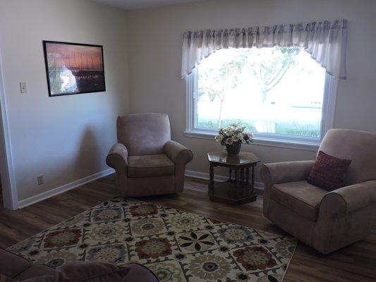 Stretch out in the formal living room with its wonderful lake views