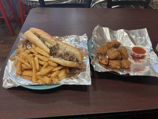 Cheese steak with fries and an order of broccoli bites