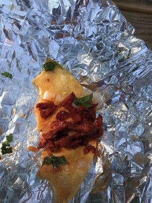 Al pastor taco - not much left. So delicious.