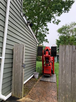 Tree Health's spider lift can travel by remote control through a 36" gate.