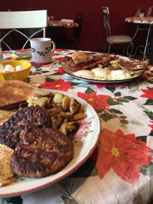 Mark breakfast with 3-eggs over medium, sausage, rye toast, home fries and coffee.