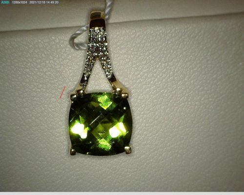 peridot with diamond pendant has matching earrings set in gold