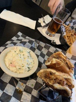 The pulled pork sandwich with coleslaw. Topped with perfect Onion Rings