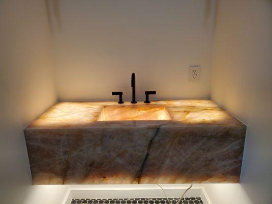 Pink quartz vanity back-lit with LED tape Lighting