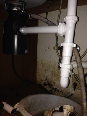 Replace with new garbage disposal and re pipe the drainage.  No more leaks and happy customers.