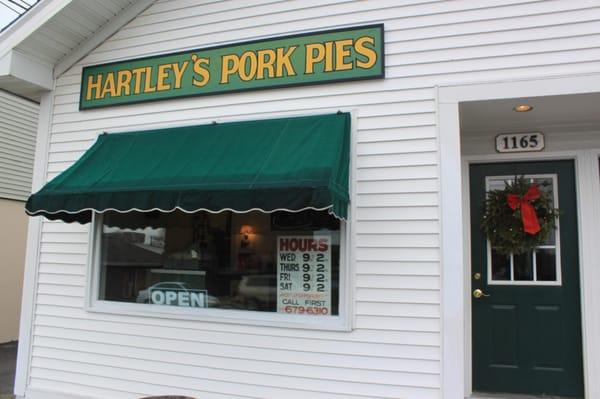 The store front of Hartley's Pork Pies, decorated for the holidays