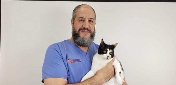 Dr. Atmani with Trixie.  When you come to the clinic you will be sure to meet her.