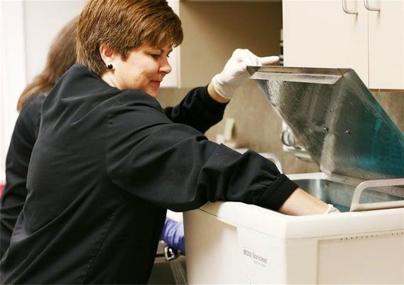 Dental Assistant sterilizing equipment