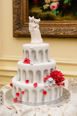 White Almond and pistachio cake with raspberry filling and a white chocolate fondant, Cakes by Linda.