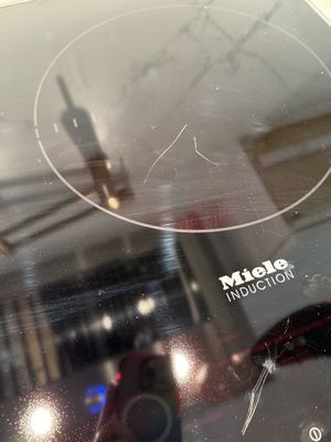 Multiple, deep scratches in brand new Miele induction top