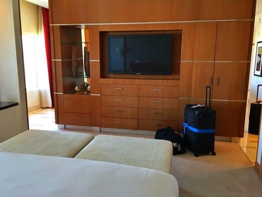 Nice bedroom tv with electronic crestor control panel for the curtains, lights and tv