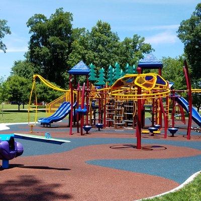 this playground is loaded with stuff for kids to play on!