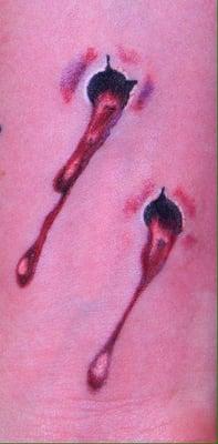 Vampire bite tattoo