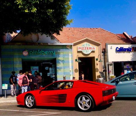 Pinkberry crowded packed with school kids and w/a vintage guy who drives a vintage Ferrari