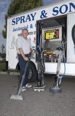 The owner Gary with tools used to clean carpets and tile