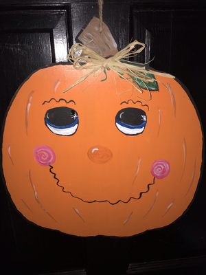 Handcrafted and hand painted pumpkin door hanger