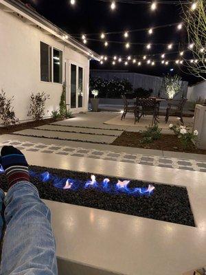 Fire pit, landscape lights and party string lights