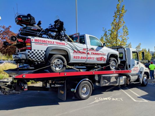 Showcase photo of our motorcycle truck loaded on our flatbed at a local event