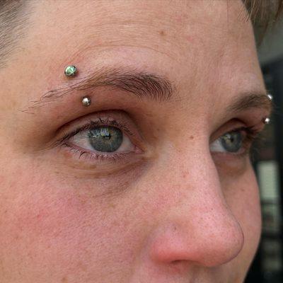 Paired Eyebrow piercings by Kenzie at IRIS Studios Grand Rapids