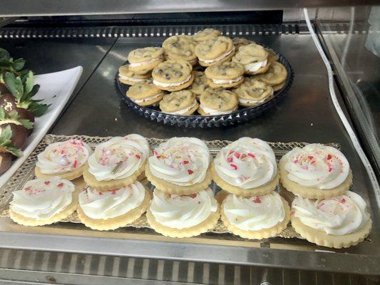 Frosted cookies and cookie sandwiches