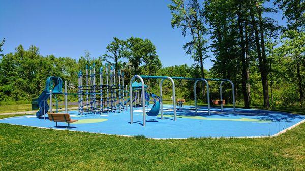 Lots of swings, a nice playground, and some shade too!