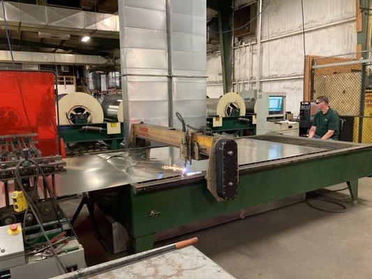 Our plasma cutter machine working on fittings for our in-house workshop.