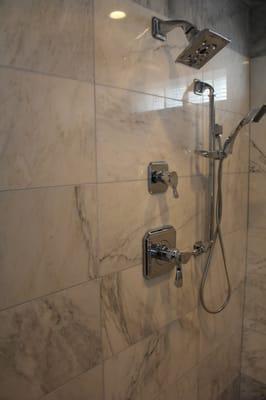 Carrara marble 12x24 tile with Brizo chrome shower fixtures