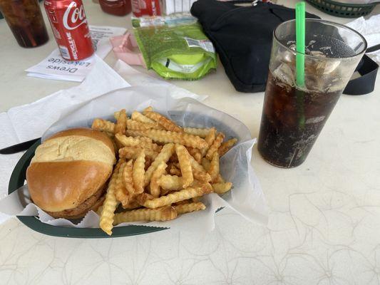 Spicy chicken sandwich with fries and Coca Cola