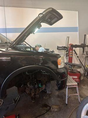 One of our guys gettin the job done! This was a exhaust manifold job, where the whole engine had to come out of the vehicle!