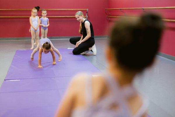 Acro students with teacher