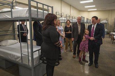 Executive Director of Gospel Rescue Mission, Lisa Chastain, gives tour to Governor and group.