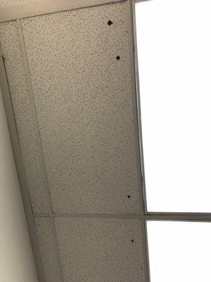 Ceiling tiles above dressing rooms